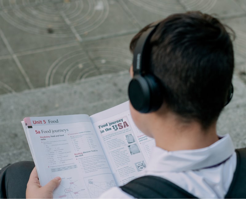Student Studying with Headphone On